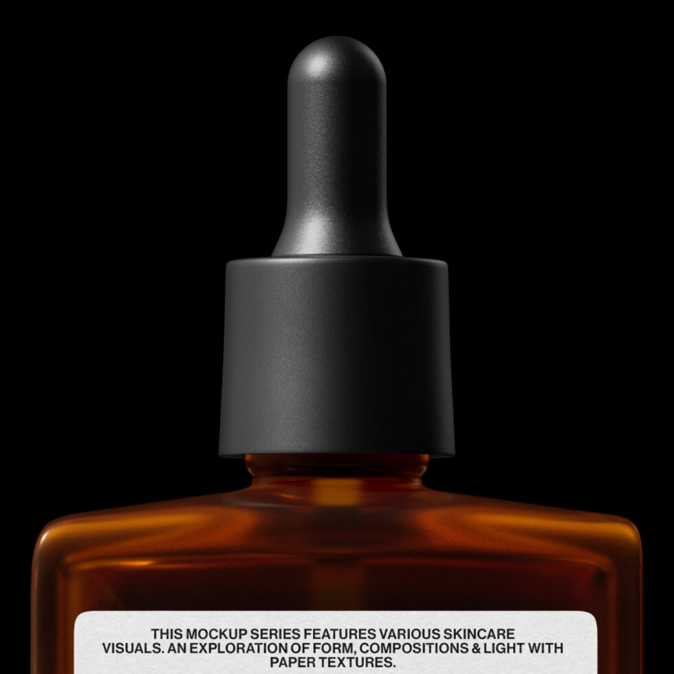 Amber glass dropper bottle with black cap isolated on black background