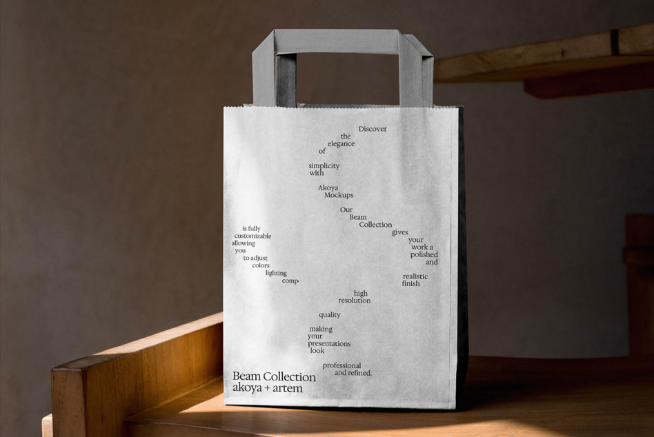 White kraft bag with Beam Collection text on wooden table in studio