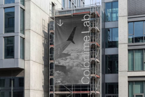 Gray construction banner showing airplane wing with ColorLab text