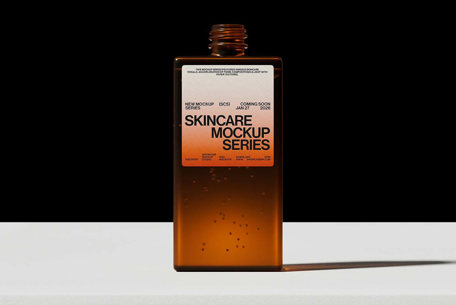 Amber glass bottle with orange label mockup on white surface