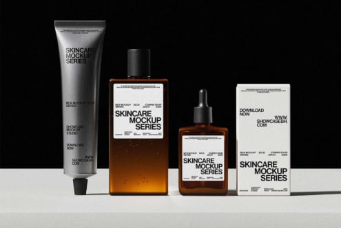 Skincare mockup set with silver tube, amber bottles, dropper, white box on black