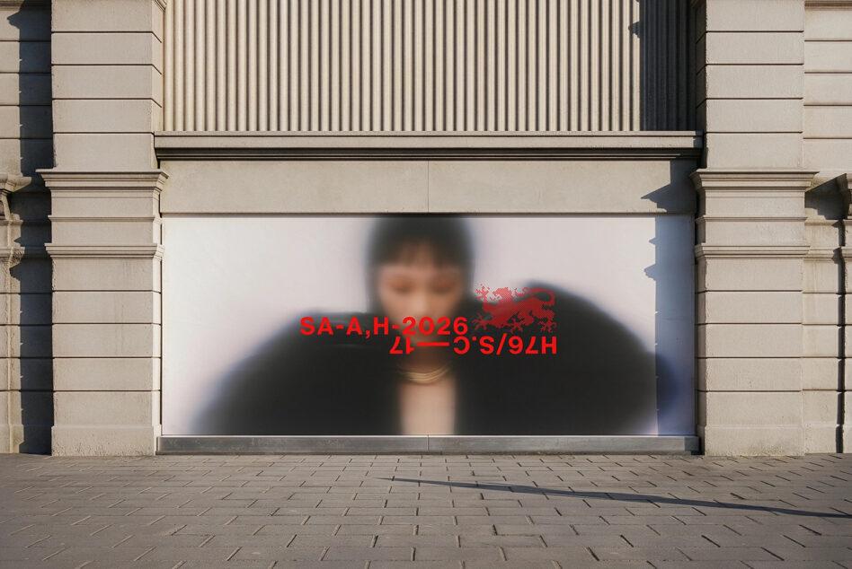 Store window with blurred person figure, red text overlay visible