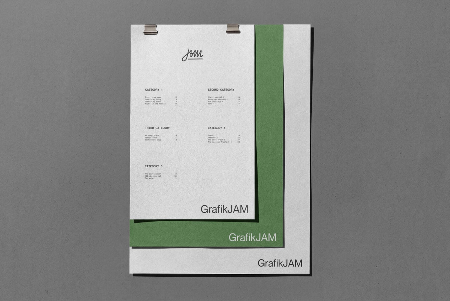 Stacked clipboard mockups with cream cover, green spine, showing menu layout
