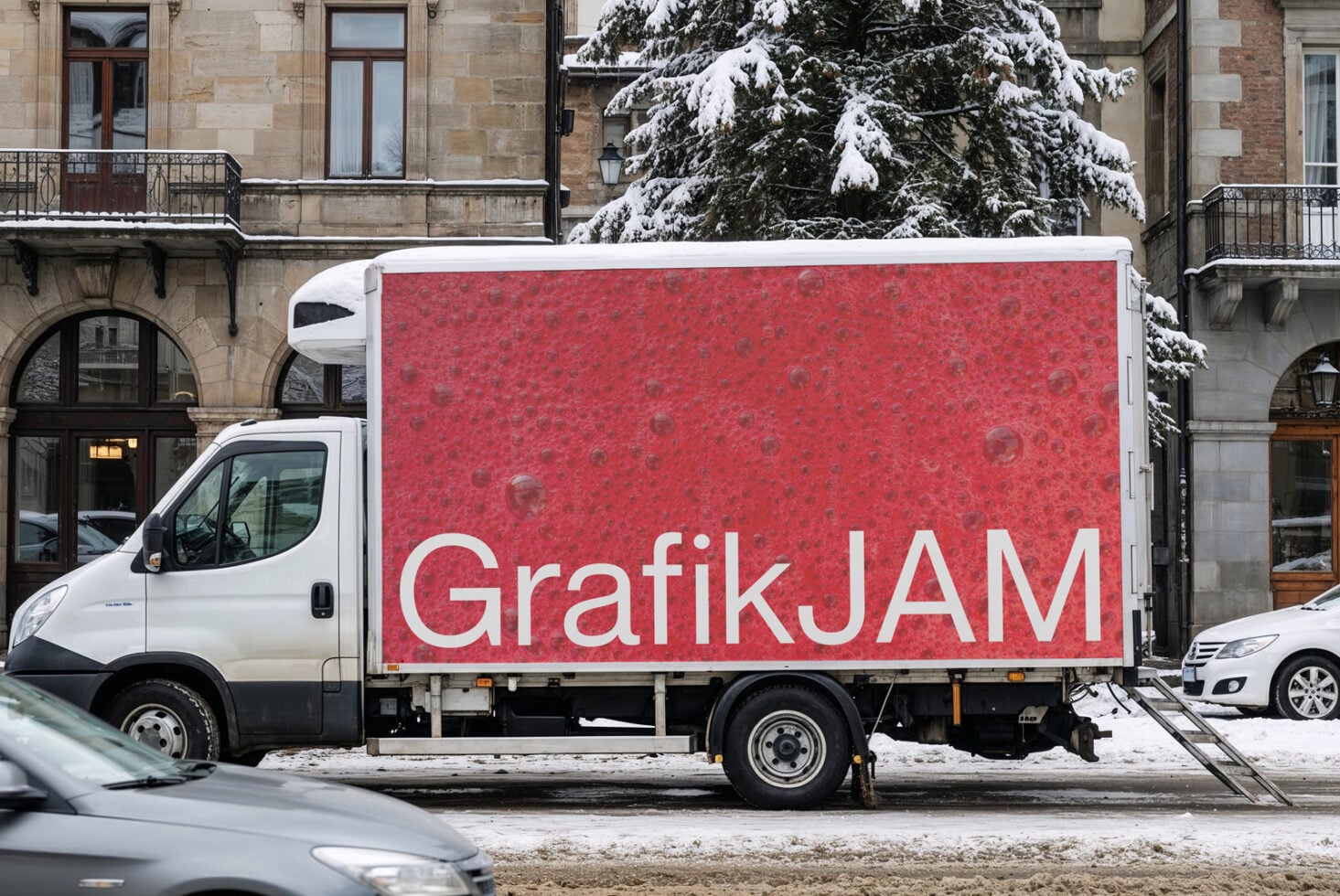 Delivery truck wrap mockup showing red panel with white script logo