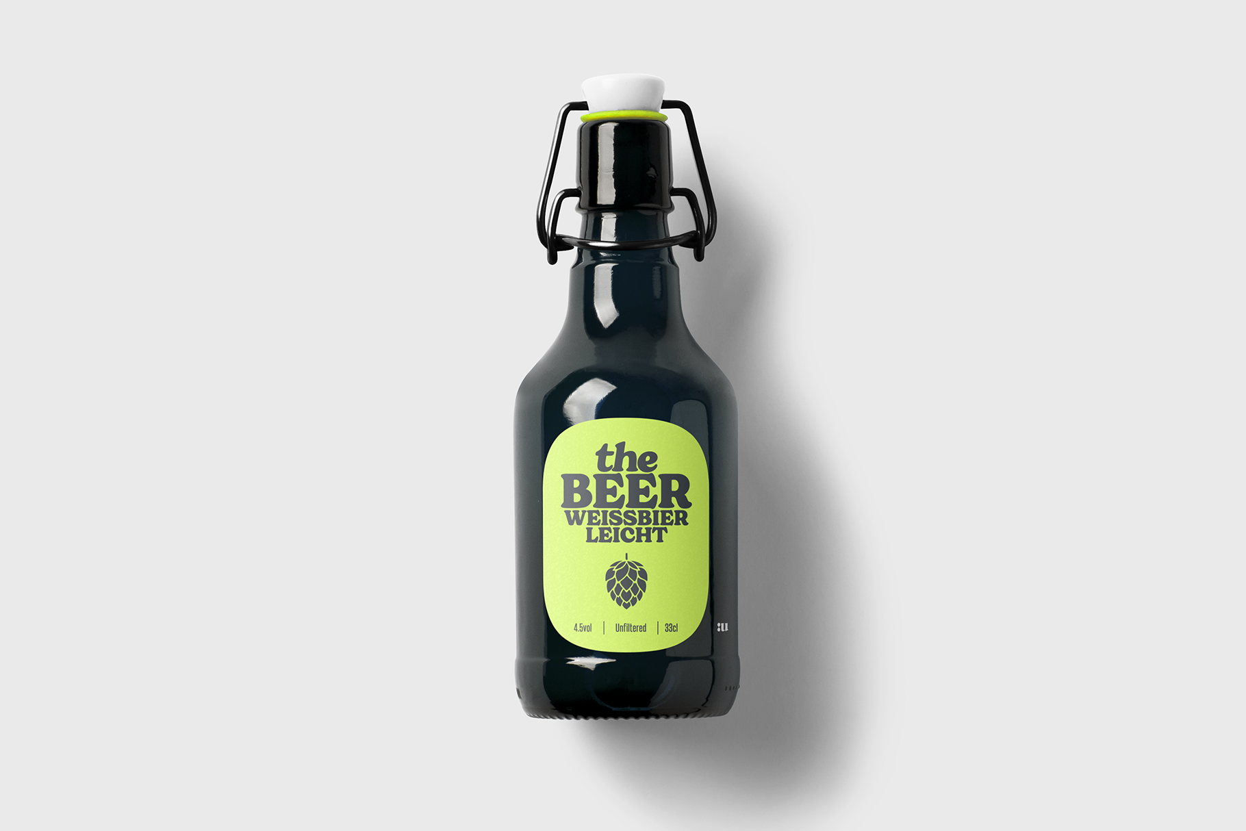 Dark beer bottle with neon yellow label reading the Beer Weissbier Leicht