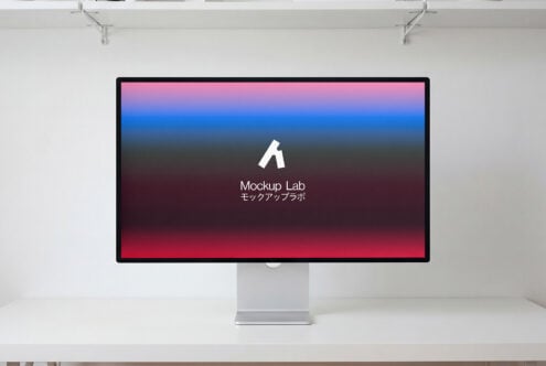 Desktop monitor showing red to blue gradient background with white logo