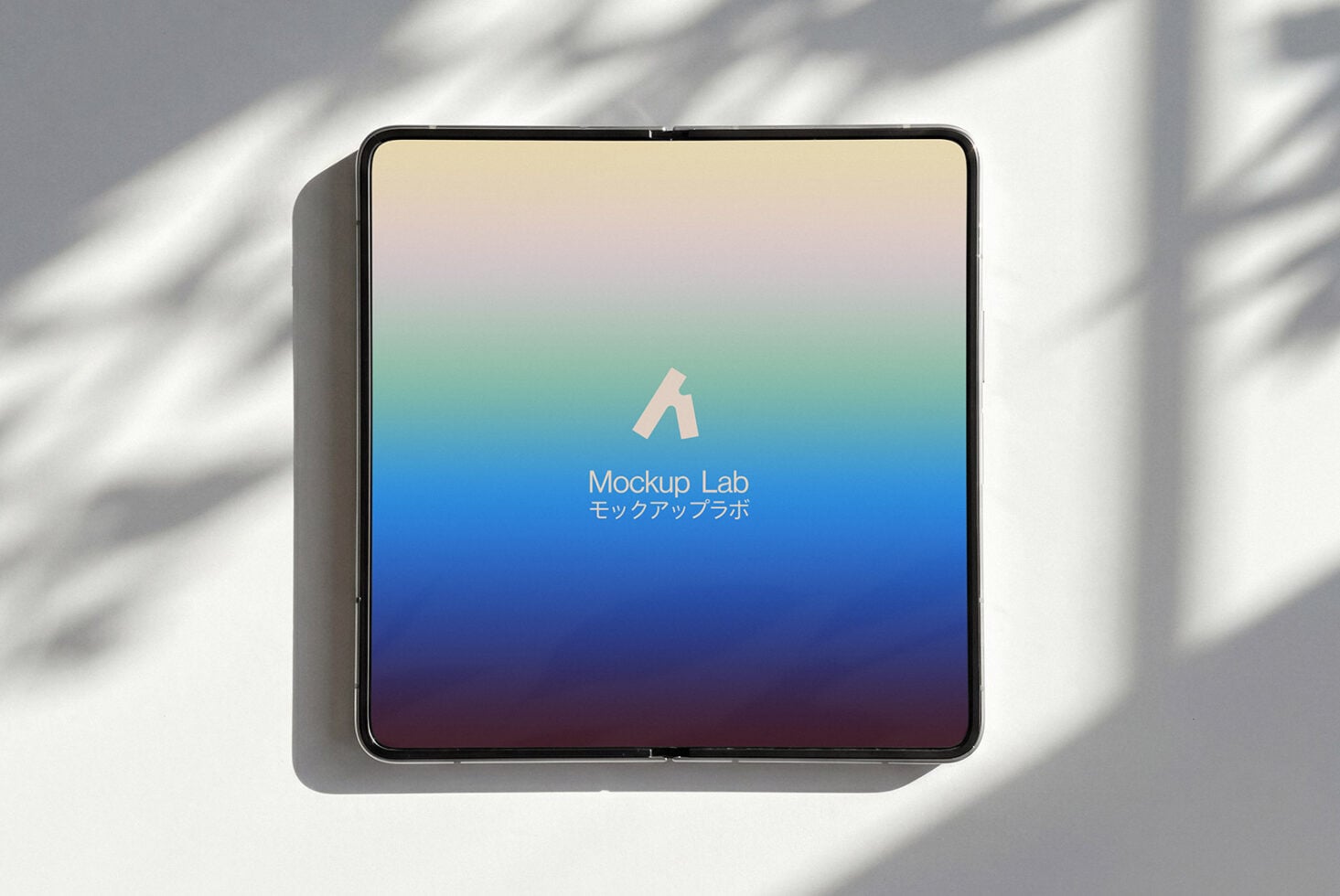 Square tablet showing soft gradient wallpaper from cream through blue to purple