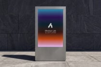 Public display kiosk with vibrant gradient screen in urban setting