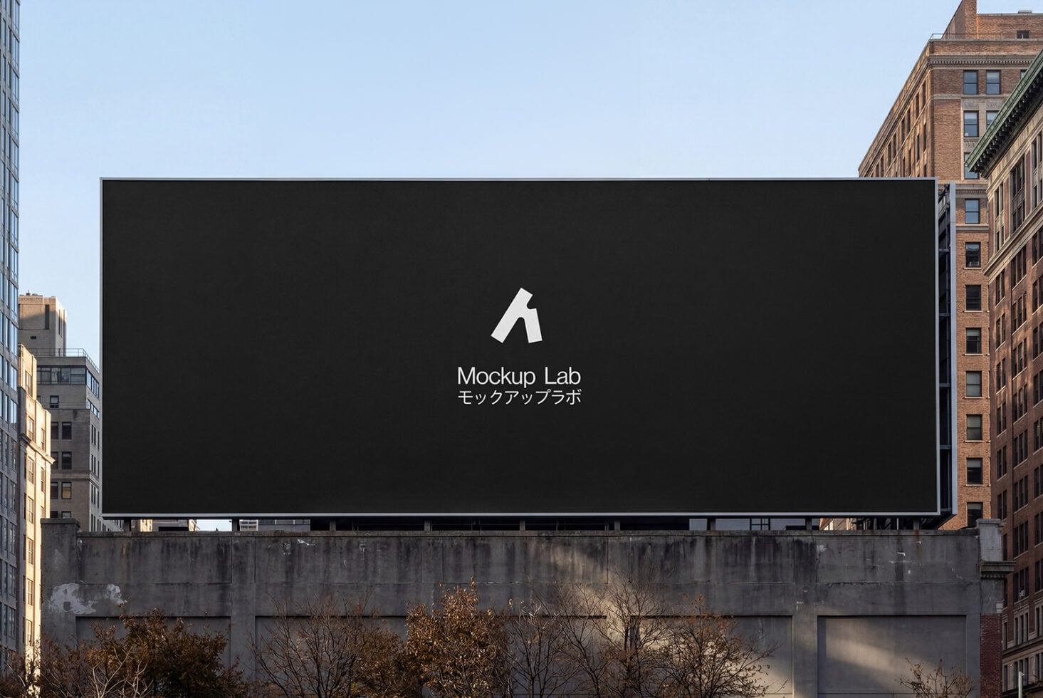 Black billboard with white Mockup Lab logo centered, urban buildings backdrop