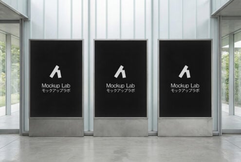 Three large black digital signage panels in minimalist glass storefront setup