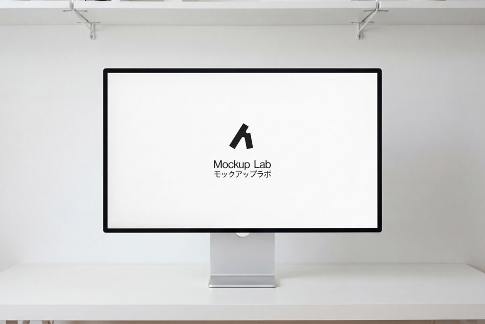 Desktop monitor with pink to blue gradient displaying white logo on desk