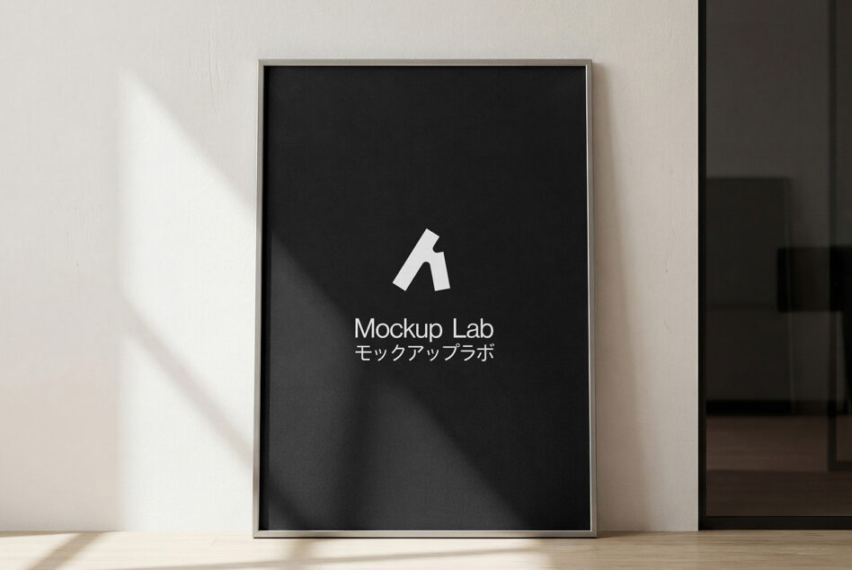Framed poster with black background displaying white logo on gallery wall