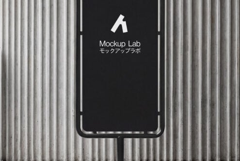 Black phone stand mockup with dark screen on concrete wall with vertical ridges texture