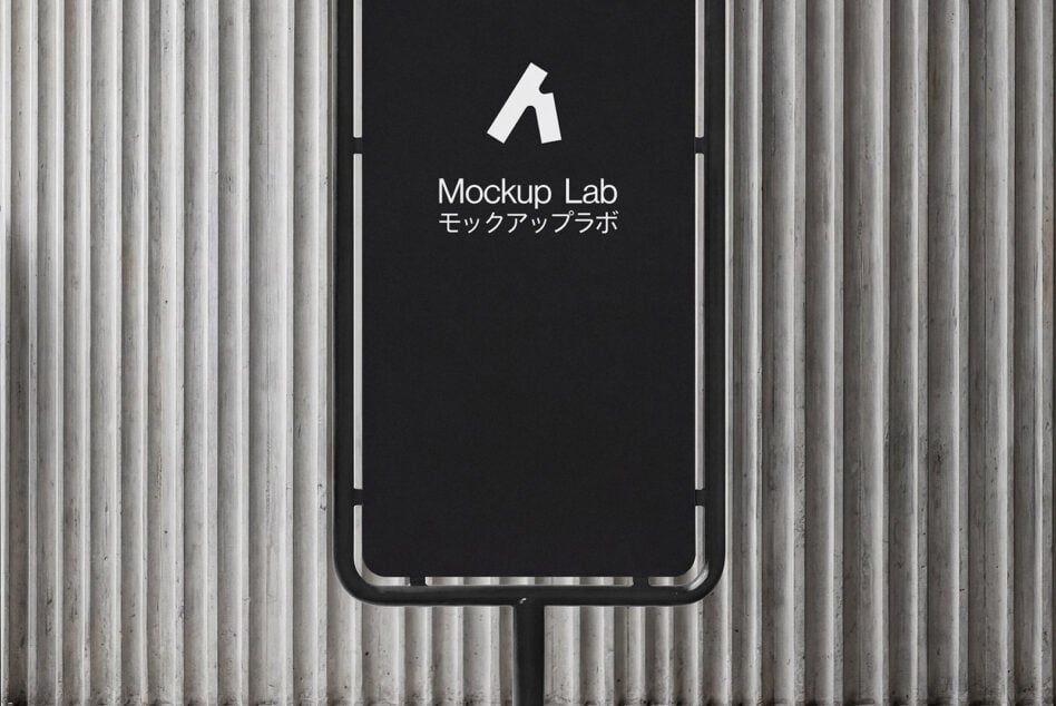 Black phone stand mockup with dark screen on concrete wall with vertical ridges texture