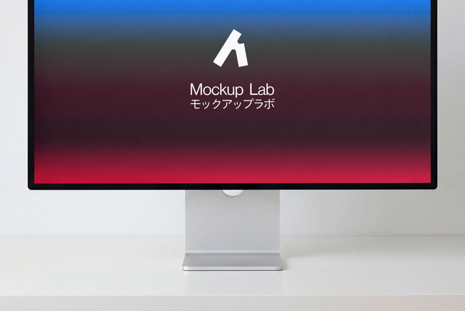 Desktop monitor displaying gradient background with white centered logo