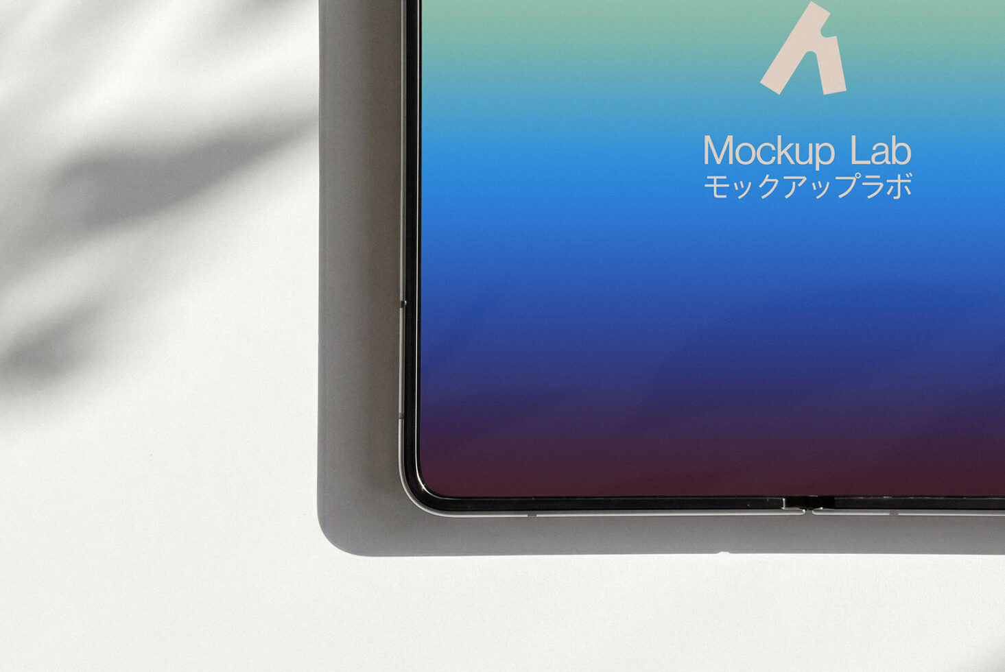 Smartphone corner showing gradient screen from teal to blue with Mockup Lab branding