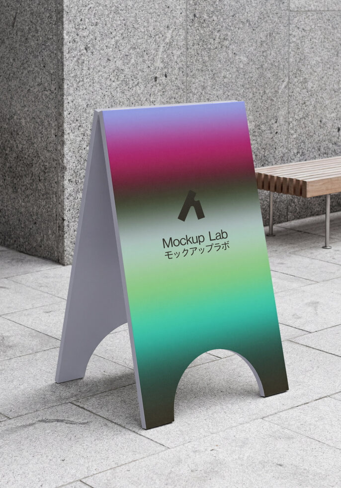 A-frame sidewalk sign with purple to green gradient on concrete patio