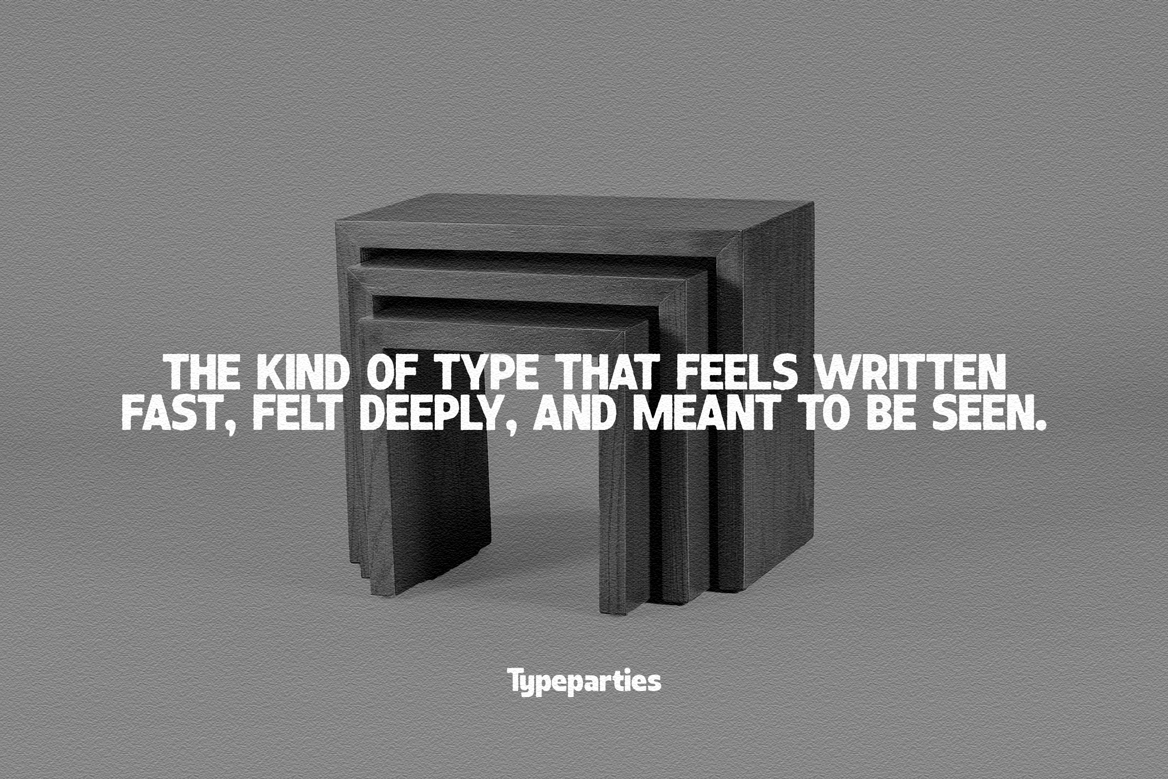 Nested dark cube shapes with white typography overlay on gray background