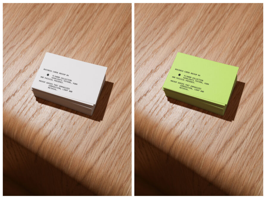 Two stacked business card piles in white in lime green on wood