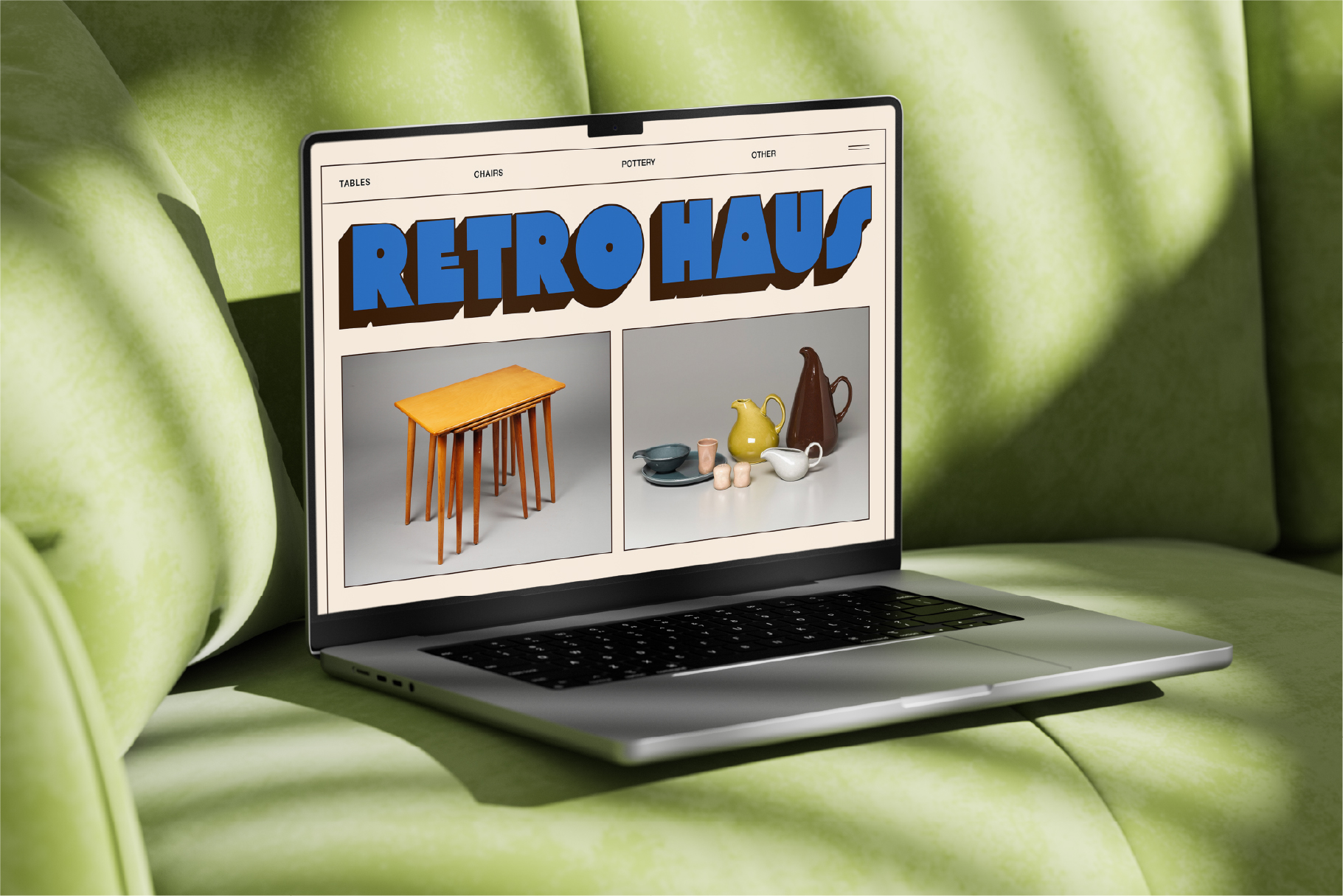 Laptop displaying Retro Haus website with orange table, ceramic tableware