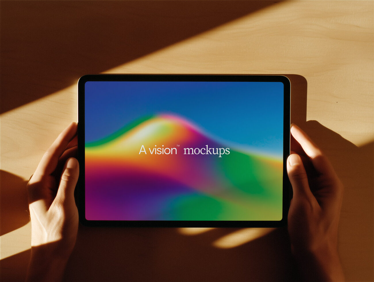Hands holding tablet showing colorful gradient background with text overlay