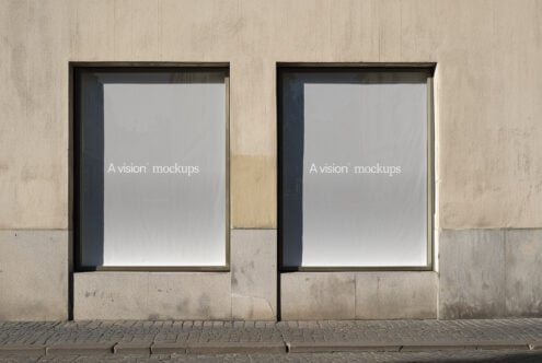 Minimalist storefront with two identical black-framed blank poster mockup templates