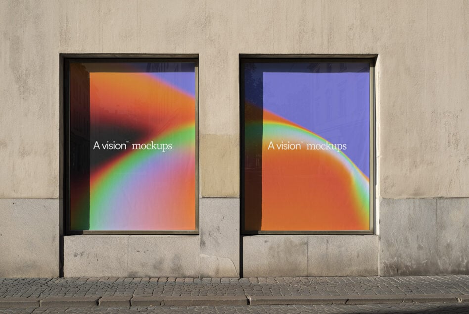 Urban storefront window showing dual framed displays with colorful gradient backgrounds