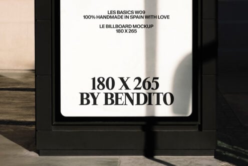 Black framed billboard mockup mounted on wall with sample text layout