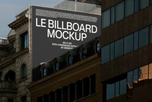 Dark billboard mockup on building facade showing Le Billboard Mockup text layout