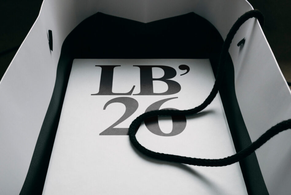 Luxury packaging with rope detail showing serif letters on white stock