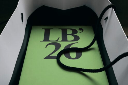 Shopping bag mockup with lime green label showing LB'25 text in black serif font