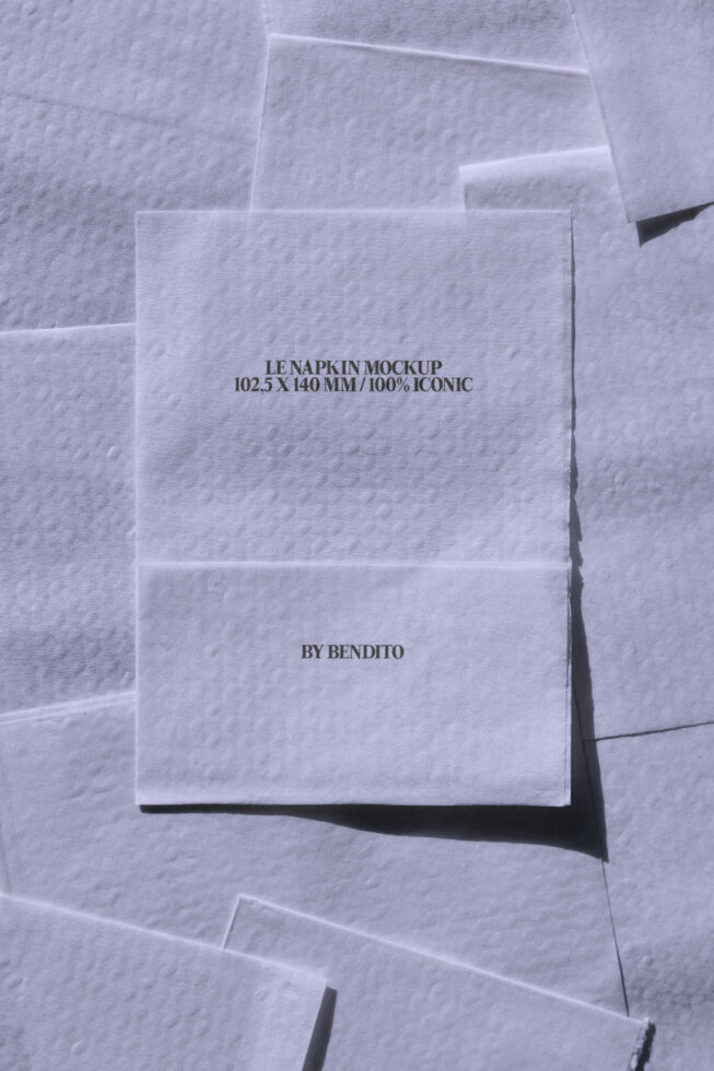Stack of white napkin mockups with text printed on textured paper surface