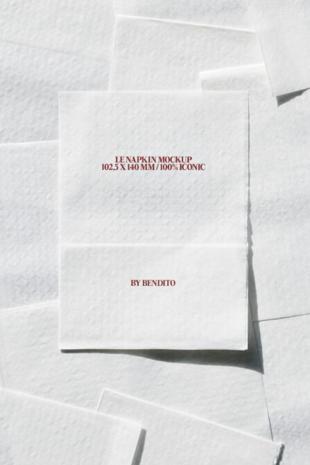 Stack of cream napkin mockups with burgundy text on fibrous paper background
