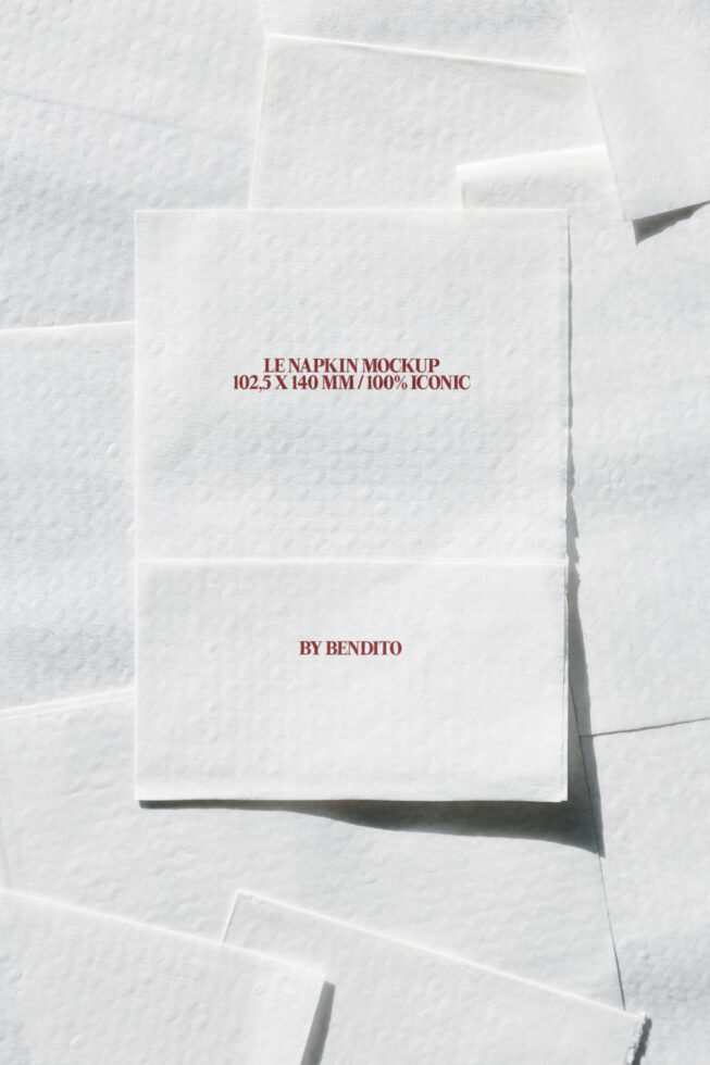Stack of cream napkin mockups with burgundy text on fibrous paper background