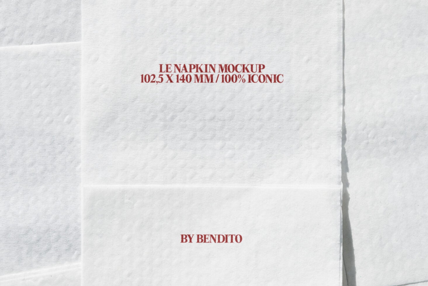 Ivory napkin mockup with burgundy text layout displayed on white surface
