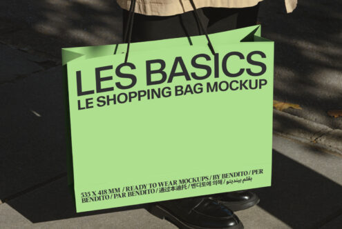 Bright lime tote bag display with black handles in natural sunlight