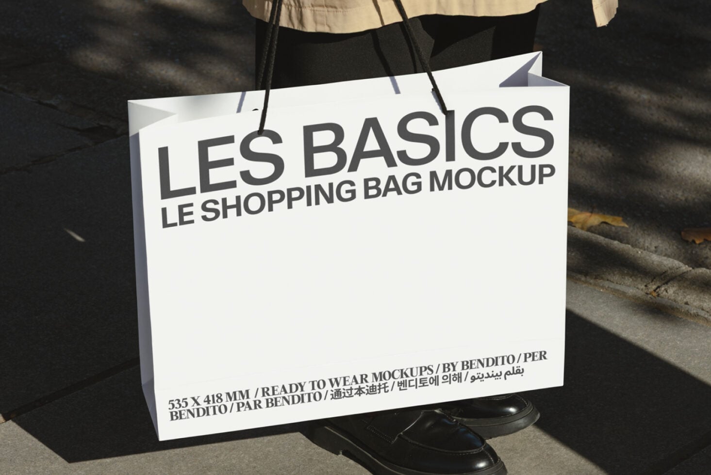 Off-white retail bag mockup carried outdoors with shadow detail