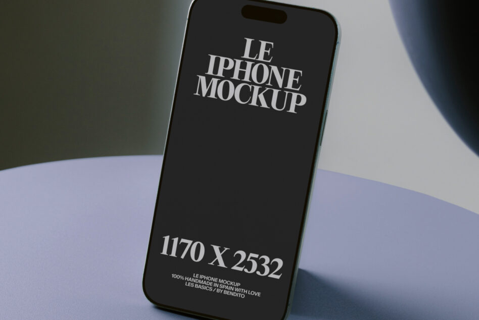 Black iPhone screen displayed at angle on pastel surface with dramatic light