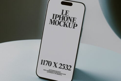 White iPhone on pale background showing serif text display clearly