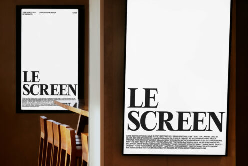 Bright monitor display with LE SCREEN text, white desk workspace with natural light