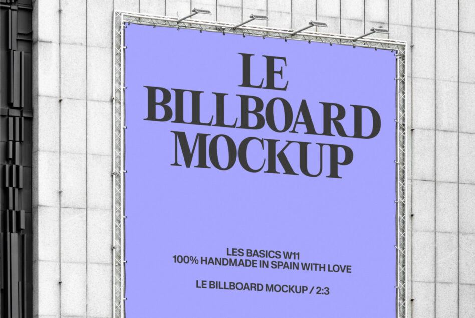 Wide shot of bright blue billboard with Le Billboard Mockup text on white grid wall