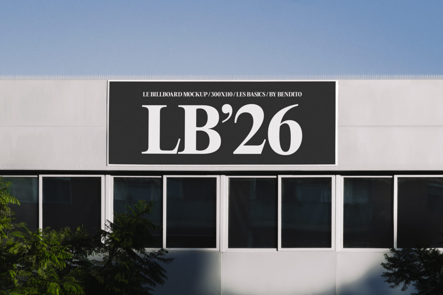 Dark signage mockup on storefront with white serif lettering against black background