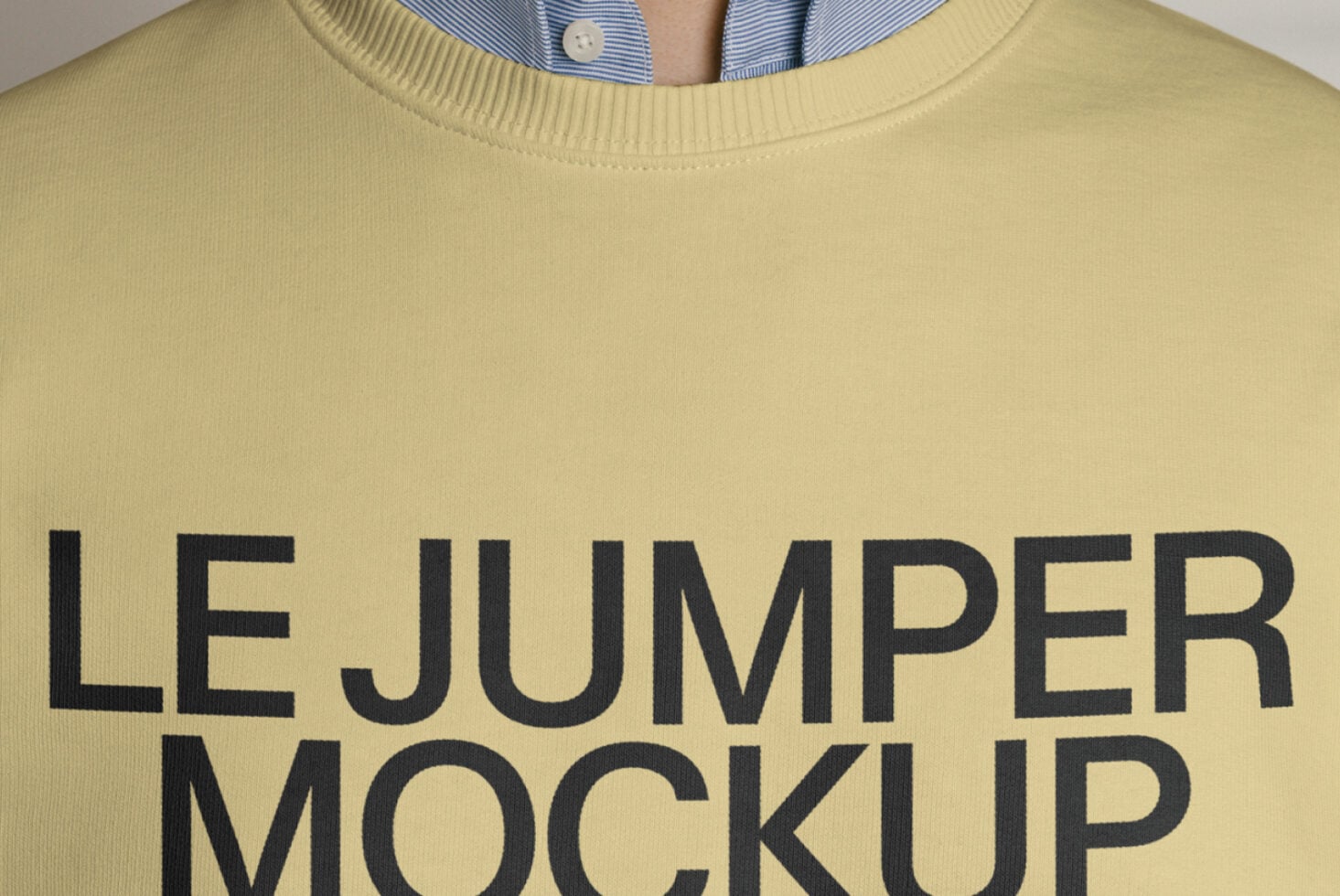 Close up of yellow crewneck sweatshirt with large text print
