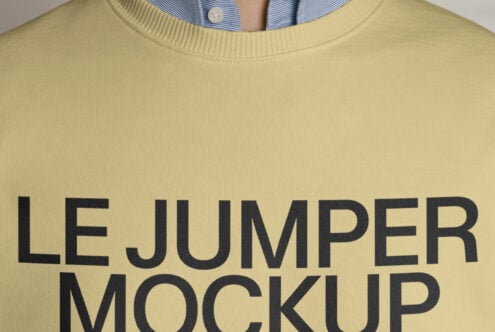 Close up of yellow crewneck sweatshirt with large text print