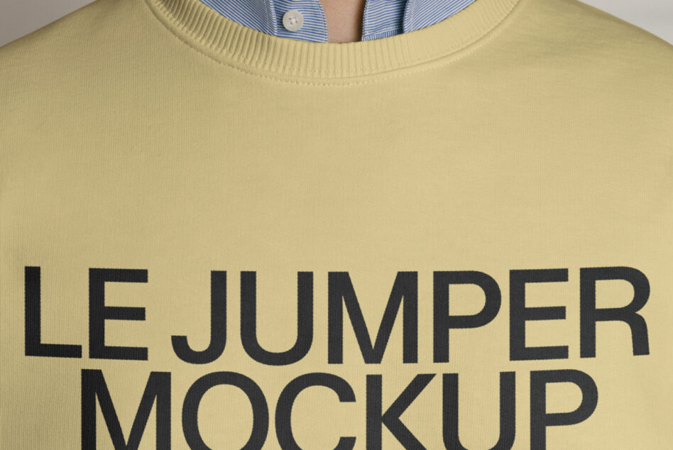 Close up of yellow crewneck sweatshirt with large text print
