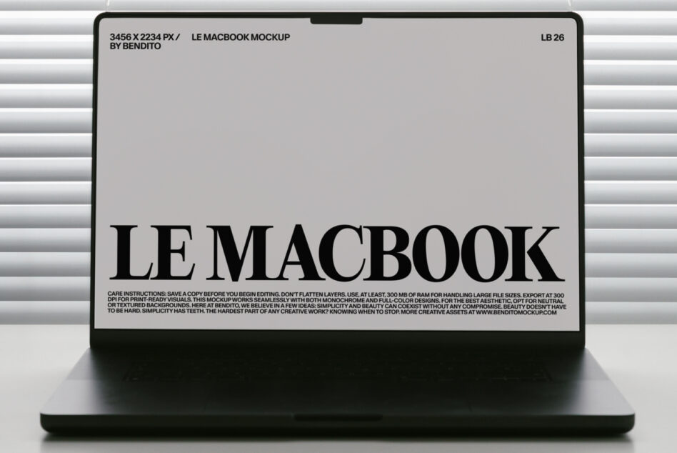 MacBook mockup with light screen displaying black serif typography in minimalist window setting