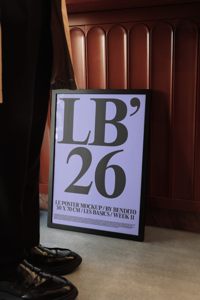 Framed poster mockup with lavender background displaying large serif typography in interior setting