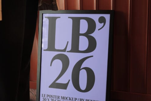 Close-up of framed poster mockup with lavender background showing large serif letters in gallery space