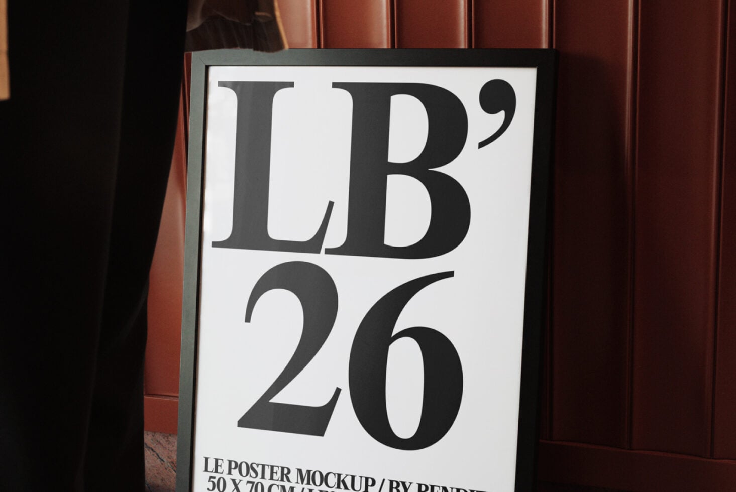 Close-up of framed poster mockup with white background displaying serif typography in gallery space
