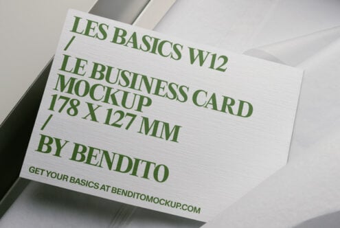 White business card mockup with green text in minimalist box display